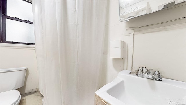 bathroom with toilet and sink