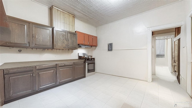 kitchen with range with electric stovetop and dark brown cabinetry