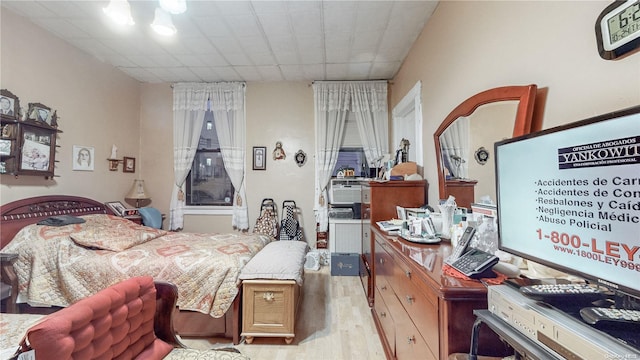 bedroom with light hardwood / wood-style floors