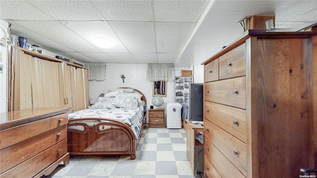 bedroom featuring a paneled ceiling