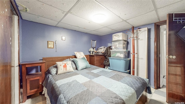 bedroom featuring a drop ceiling