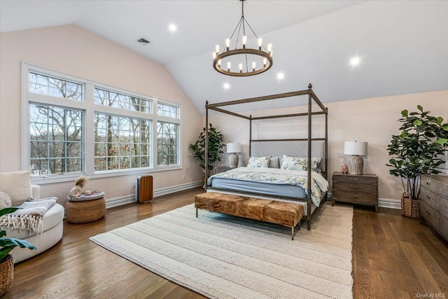 bedroom featuring vaulted ceiling, a chandelier, and dark hardwood / wood-style floors