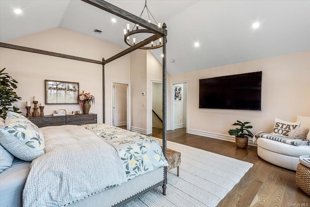 bedroom featuring a chandelier, dark hardwood / wood-style floors, and high vaulted ceiling