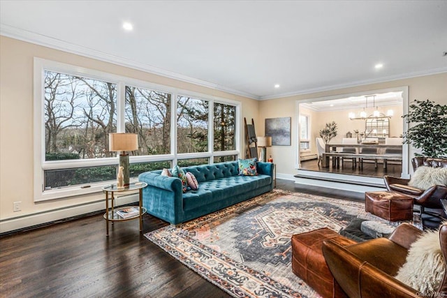 living room featuring hardwood / wood-style floors, an inviting chandelier, baseboard heating, and ornamental molding