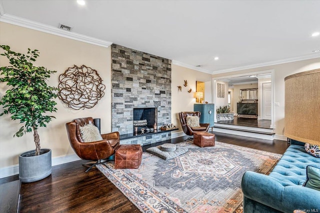 living room with a fireplace, dark hardwood / wood-style flooring, and ornamental molding