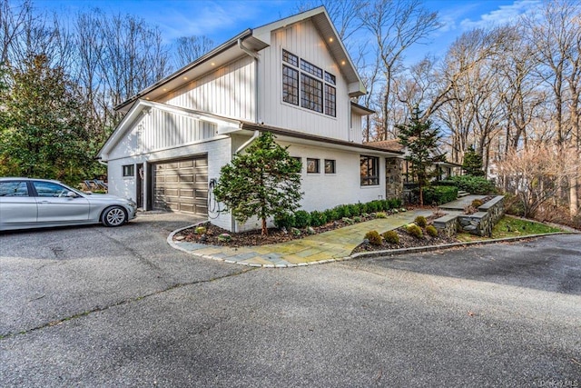 view of property exterior with a garage