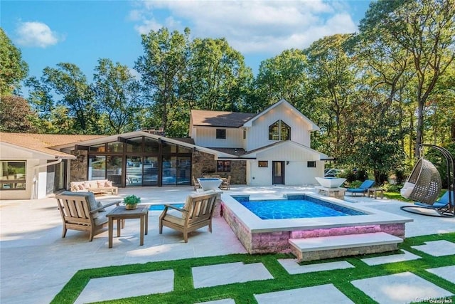 339 Ridge Ln, Mill Neck, NY 11765 - back of house featuring an outdoor pool, a patio, an outdoor living space, and a jacuzzi