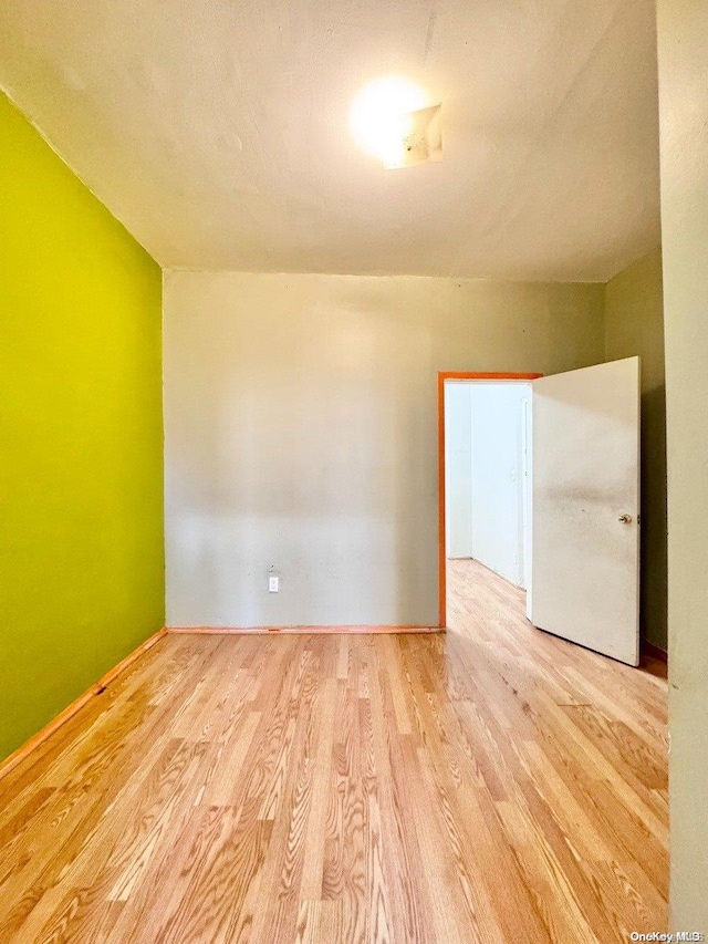 spare room featuring light hardwood / wood-style floors