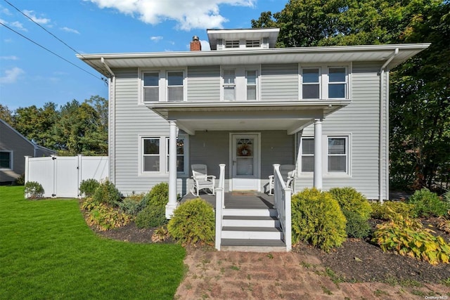 18955 Main Rd, Mattituck, NY 11952 - traditional style home with covered porch, a chimney, and a gate