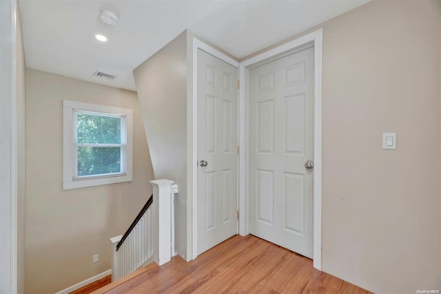 hall with light wood-type flooring