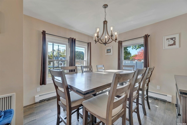 18955 Main Rd, Mattituck, NY 11952 - dining area featuring a baseboard heating unit, a chandelier, and plenty of natural light