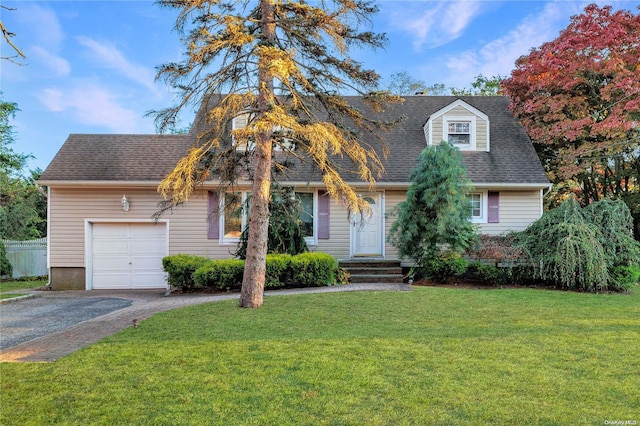 cape cod home with a front lawn, roof with shingles, driveway, and an attached garage