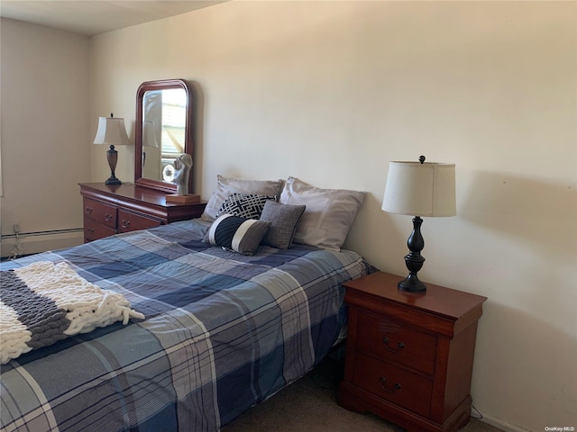 carpeted bedroom with a baseboard radiator