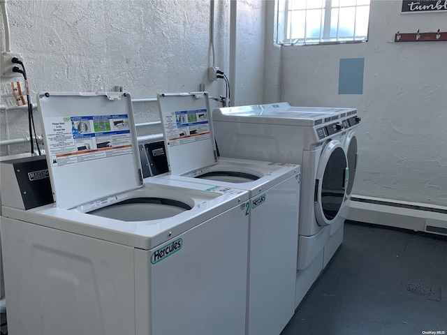 laundry area with independent washer and dryer