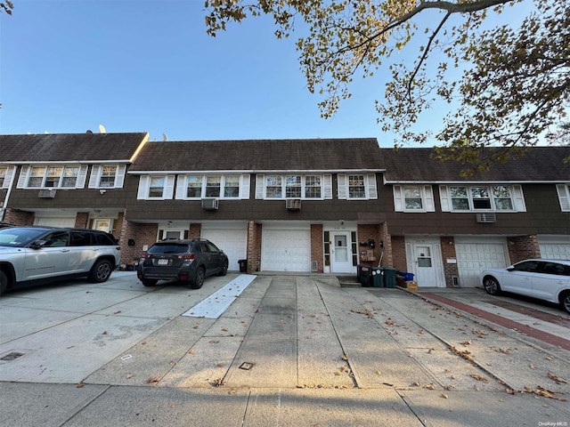 townhome / multi-family property featuring a garage