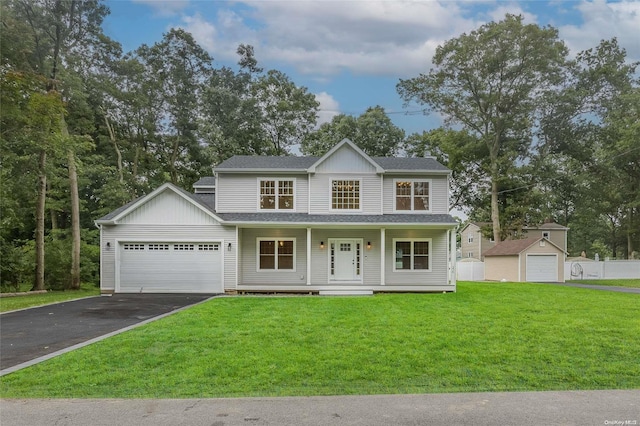 view of front of house with a front lawn, a porch, and a garage