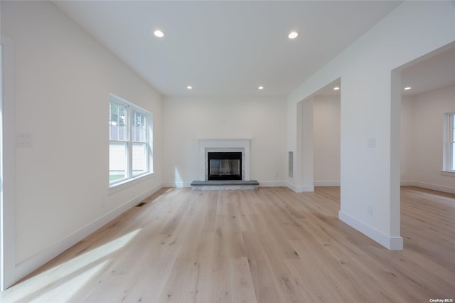 unfurnished living room featuring light hardwood / wood-style flooring