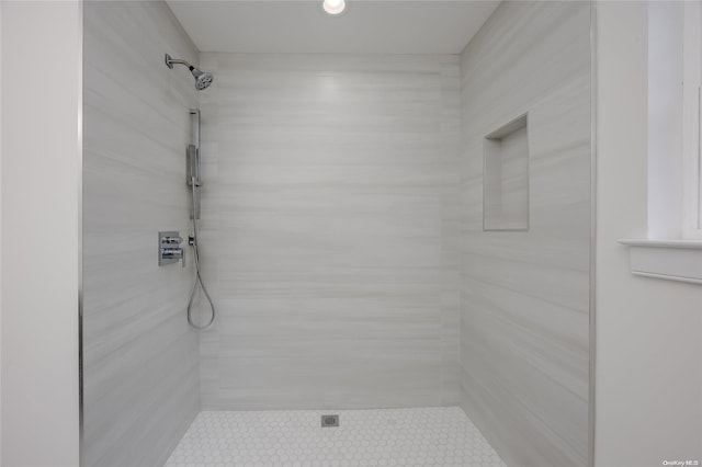 bathroom with a tile shower