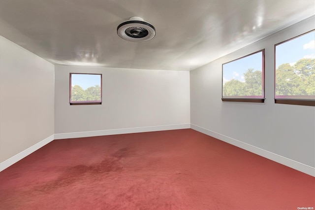 carpeted empty room with plenty of natural light