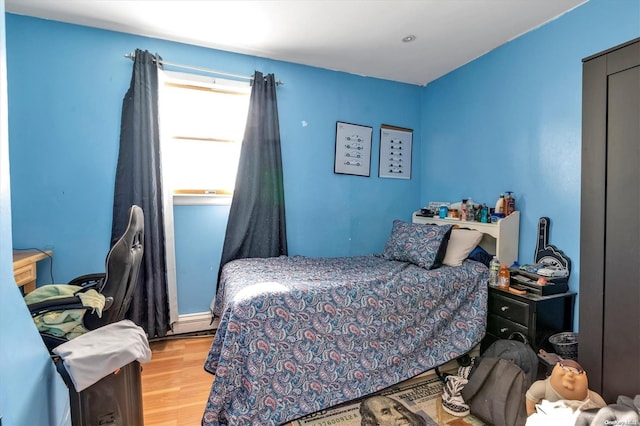 bedroom featuring light hardwood / wood-style floors and a closet