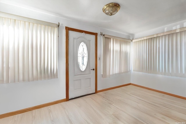 foyer entrance with light wood-type flooring