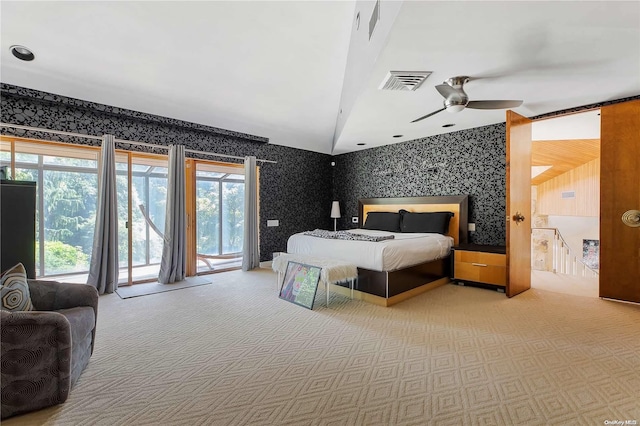 carpeted bedroom featuring access to exterior and ceiling fan