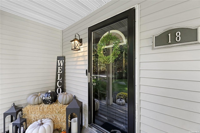 view of exterior entry with covered porch