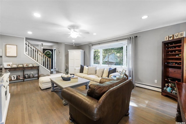 living room with hardwood / wood-style flooring, ceiling fan, ornamental molding, and baseboard heating