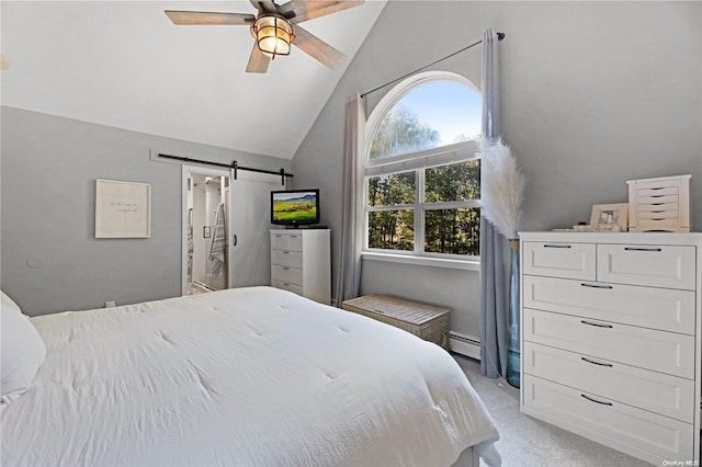 carpeted bedroom with a barn door, ceiling fan, vaulted ceiling, and a baseboard heating unit