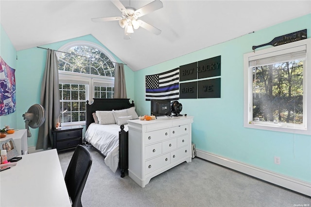 carpeted bedroom with a baseboard radiator, vaulted ceiling, and ceiling fan