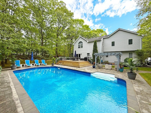 18 Diane Dr, Manorville, NY 11949 - outdoor pool with a pergola, a wooden deck, a patio, and view of wooded area