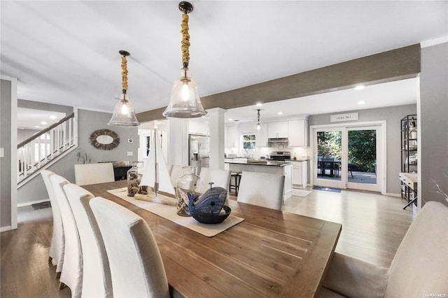 18 Diane Dr, Manorville, NY 11949 - dining space with light wood finished floors, stairway, baseboards, recessed lighting, and beam ceiling