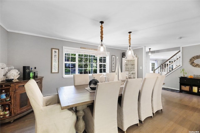 18 Diane Dr, Manorville, NY 11949 - dining area with ornamental molding, wood finished floors, stairs, and healthy amount of natural light