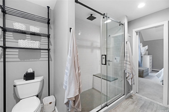 18 Diane Dr, Manorville, NY 11949 - full bath featuring a shower stall, toilet, wood finished floors, baseboard heating, and baseboards
