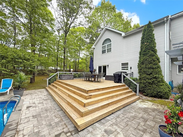 18 Diane Dr, Manorville, NY 11949 - back of property featuring outdoor dining area, a deck, a patio, and a swimming pool