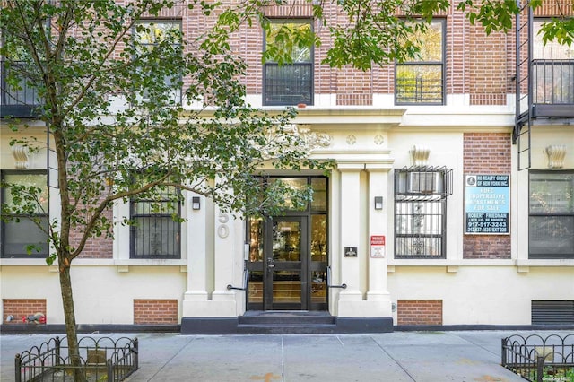 entrance to property featuring french doors