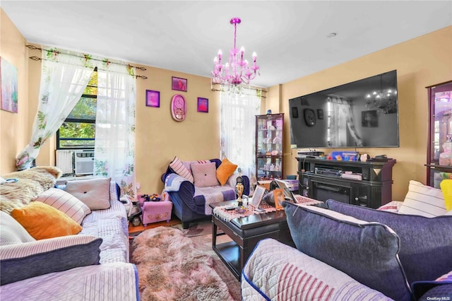 living room with hardwood / wood-style flooring, a notable chandelier, and cooling unit