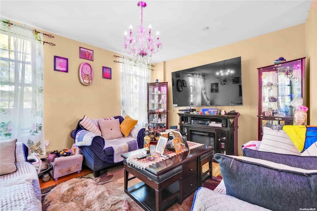 living room featuring a notable chandelier and wood-type flooring