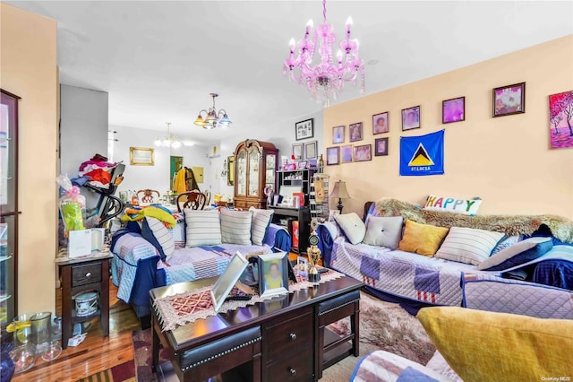 living room with hardwood / wood-style floors and a notable chandelier