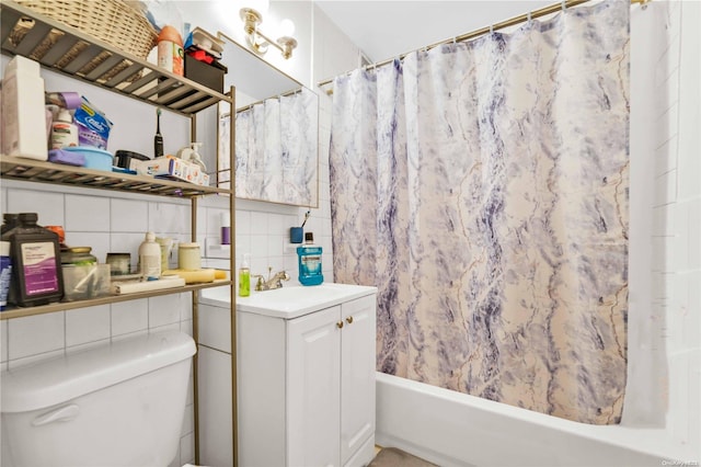 full bathroom with decorative backsplash, shower / bath combo, vanity, and toilet