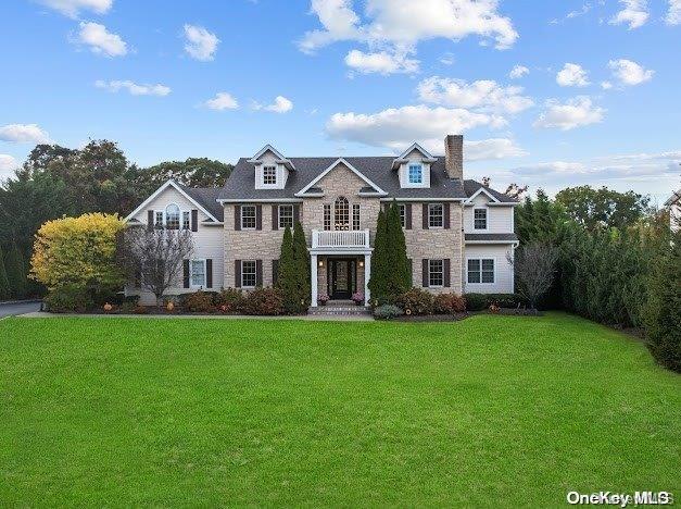 view of front of home with a front lawn