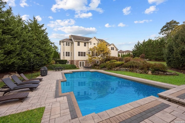 view of swimming pool featuring a patio