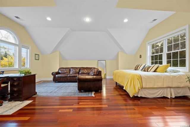 bedroom featuring dark wood-type flooring and lofted ceiling