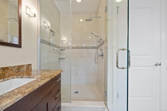 bathroom featuring vanity and walk in shower