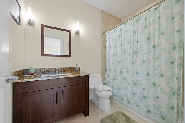 bathroom featuring a shower with curtain, tile patterned floors, toilet, and vanity