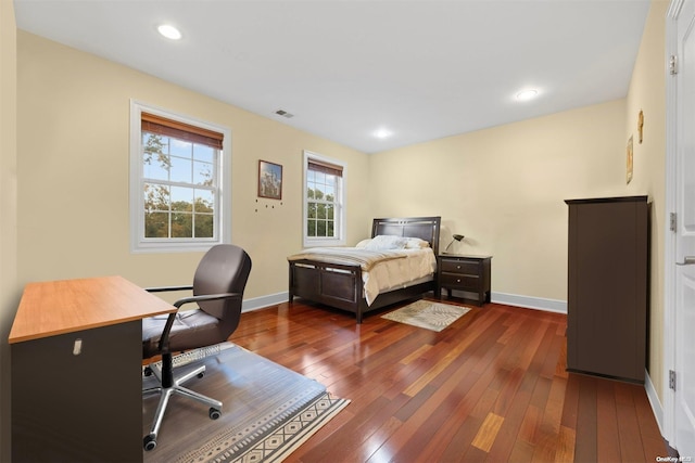 bedroom featuring dark hardwood / wood-style flooring