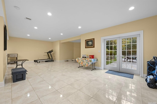 workout room featuring french doors and light tile patterned floors