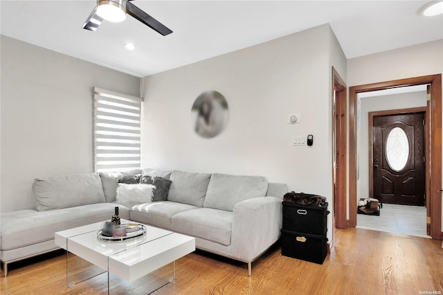 living room with a healthy amount of sunlight, ceiling fan, and wood-type flooring