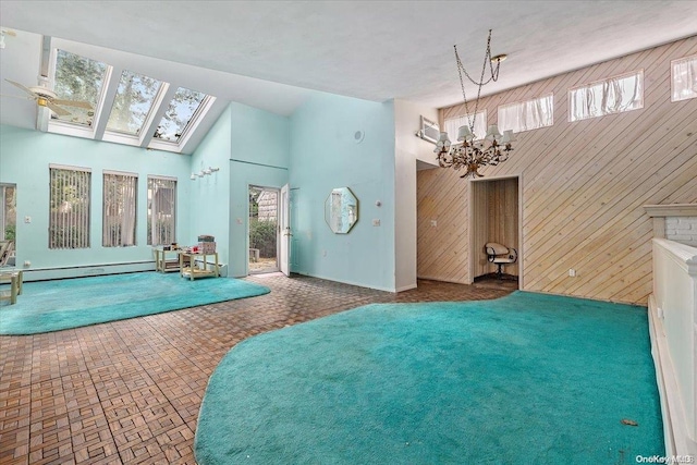 interior space featuring a skylight, a fireplace, and an inviting chandelier