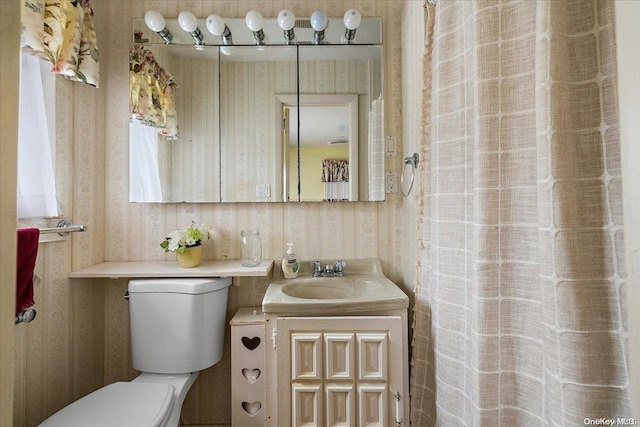 bathroom featuring vanity and toilet